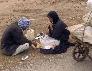 A destitute Ahwazi Arab couple, their home demolished by Iranian occupying forces, collect plastic from rubbish to sell simply in order to survive 